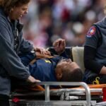Michigan-Assistant-Coach-Collapses-on-Sideline